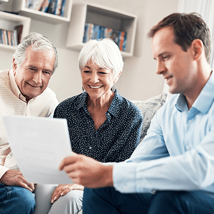 Life Insurance retired couple reviewing insurance policy with broker