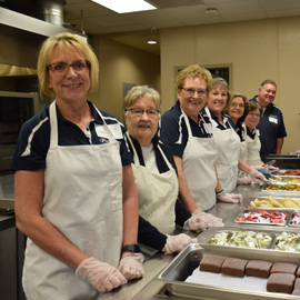Serving Others PREMIER Employees serving in buffet line