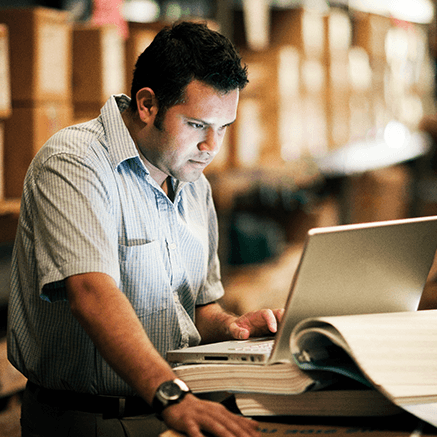 Benefits Man looking at laptop