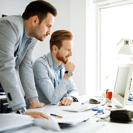 Virtual Account Management two business men looking at computer monitor