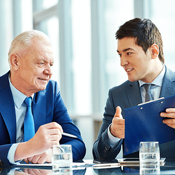 Small Business Association (SBA) Loans two business men looking over reports