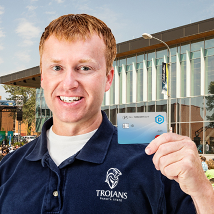 More Than a Debit Card man holding DSU branded debit card