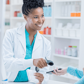 Merchant Card Services pharmacist taking payment by mobile phone