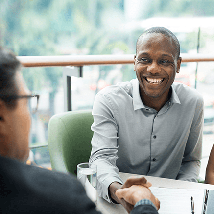 Keeping Your Interests at Heart man shaking hands with banker